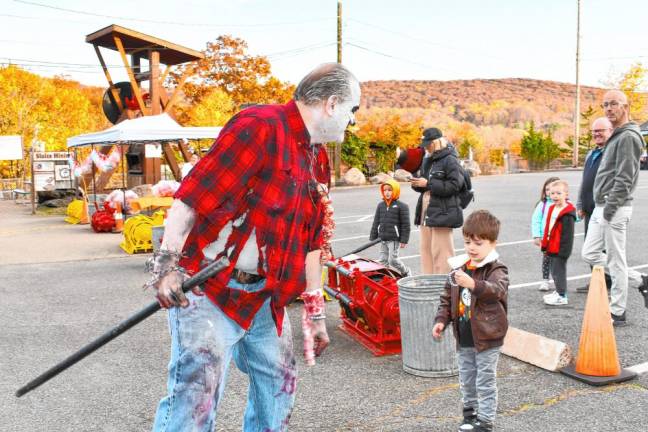 A ‘zombie’ greets visitors arriving for a Sterling Hell Haunted Mine tour Friday, Oct. 25. (Photo by Maria Kovic)