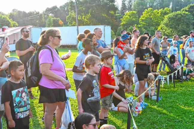 <b>Fair-goers watch the Hot Dog Pig Races on Sunday, Aug. 4. (Photo by Maria Kovic)</b>