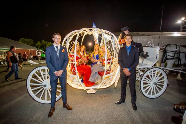 Queen of the Fair Ashleigh Dickson, left, and her Court pose in the carriage after the pageant.