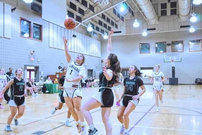 Wallkill Valley's Katie Klackowski (1) tosses the ball toward the hoop in the first half. She was credited with two assists.