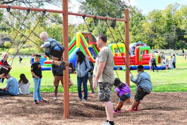 Children play on the swings.