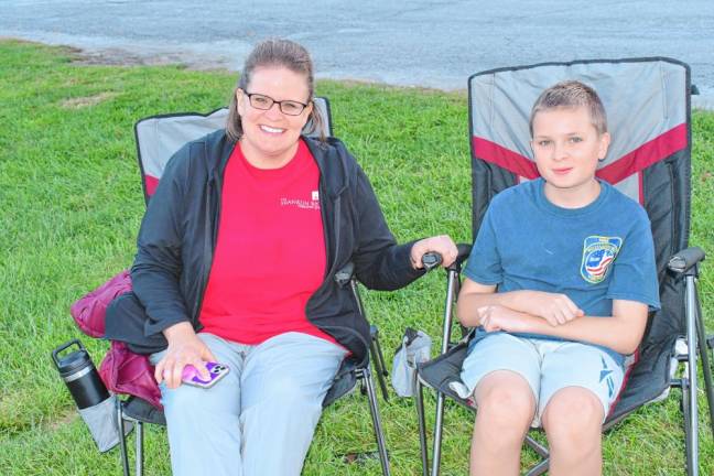 Adrienne Desch and her son Cameron of Lafayette attend the service.