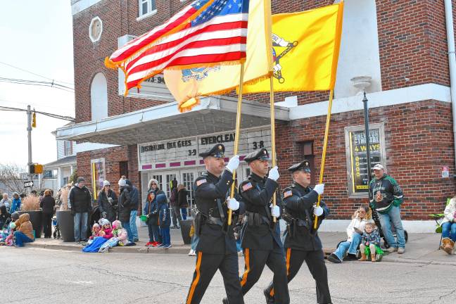 An honor guard carrying the U.S., New Jersey and Sussex County flags leads the parade.