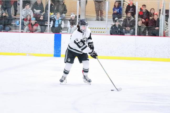 <b>Parsippany's Parker Enslow is focused on the puck.</b>