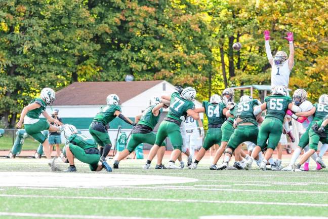 <b>Pope John’s Prince Joshua goes up to block a 50-yard field goal attempt by Delbarton’s Will Kramer at the end of the first half. Kramer kicked two field goals and three extra points in the game. </b>