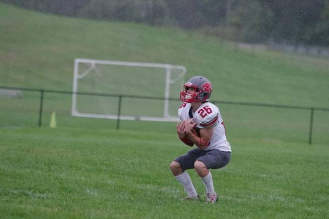 High Point kick returner Dylan Masters catches the ball in the first half.