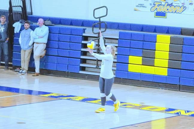 Jefferson's Peyton Bradley in the midst of a serve. She made five kills, two digs and one ace.