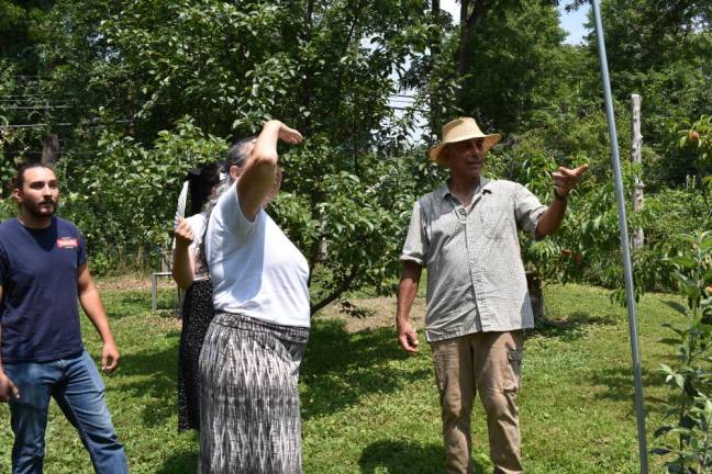 Larry Manseur of Warwick gives a tour of his orchard, which grows apples, pears, peaches, grapes, apricots and cherries.