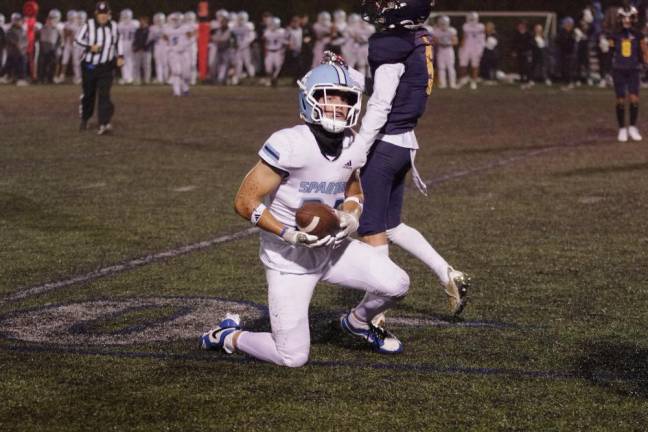 Sparta's Josh Brancy looks toward the camera after catching the ball. He scored two touchdowns in the game against Jefferson.