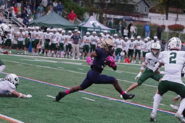 Pope John ball carrier Tylik Hill tries to evade Delbarton defenders.