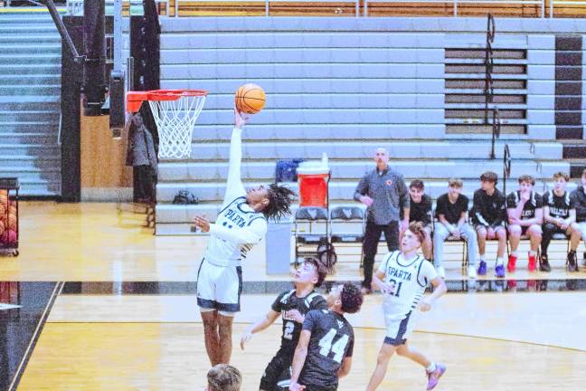 Sparta's Leshem Little glides through the air during a shot. He scored 28 points, grabbed five rebounds and was credited with one steal.