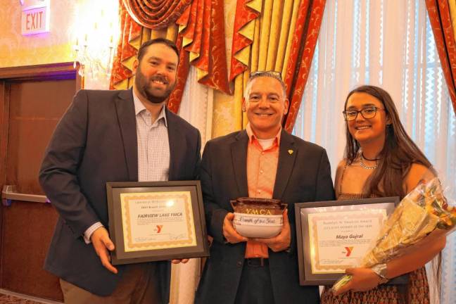 From left are Andrew Pfaff, board chairman of Fairview Lake YMCA Camps; Marc Koch, district executive director at Fairview Lake YMCA Camps; and Maya Gujral, who was named Staff Member of the Year. (Photo provided)