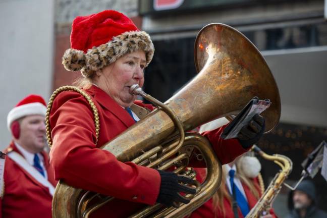 Franklin Band member Anne Erickson plays the tuba. At left is Robert Ernst on the snare drum.