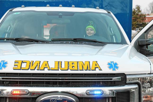 WB3 A boy checks out the driver’s seat in an ambulance during the Touch-a-Truck.