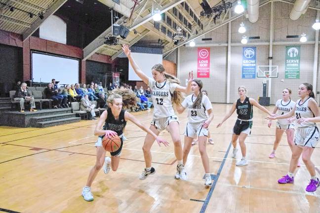 Veritas's Madelyn Seifert handles the ball. She scored 25 points.