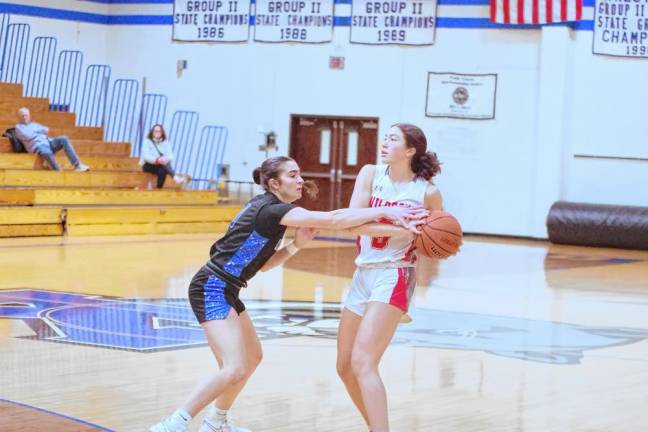 High Point's Claire Sieminski holds the ball as Kittatinny's Taylor Hough reaches for it. Sieminski scored five points.