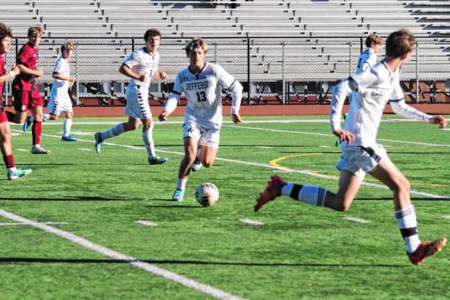 FL2 A Jefferson Falcon controls the ball in the first period.