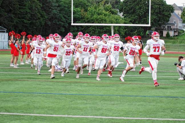 <b>The Lenape Valley Patriots run onto the field before the start of the game.</b>