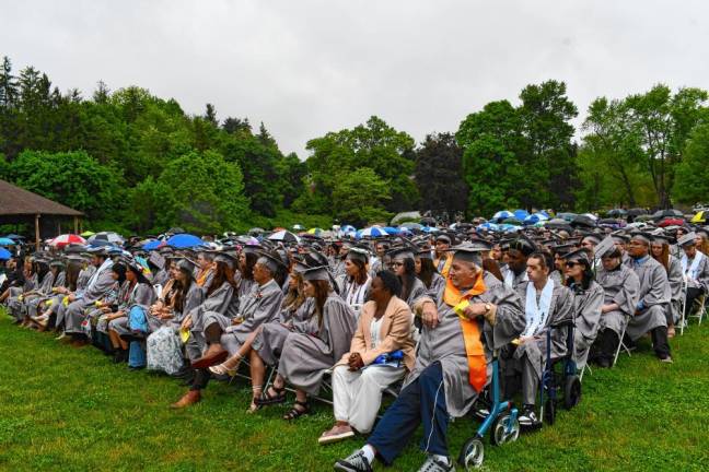 The graduates sit in the rain during commencement at Sussex County Community College on Thursday, May 16. (Photos by Maria Kovic)