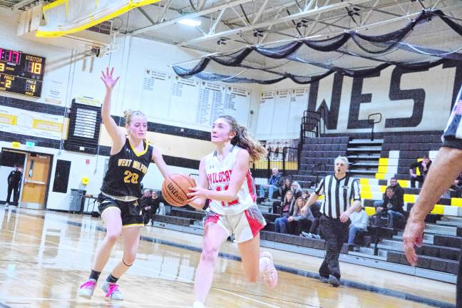 <b>HP1 High Point's Kennedy Shepherd moves the ball in the game against West Milford on Thursday, Feb. 27. The Wildcats lost, 42-28, in the first round of the NJSIAA North Jersey, Section 1, Group 2 tournament. (Photo by George Leroy Hunter)</b>