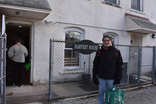 Ed Gould Sr. waits in line at Harvest House in Sussex, which serves a hot lunch Monday through Friday.