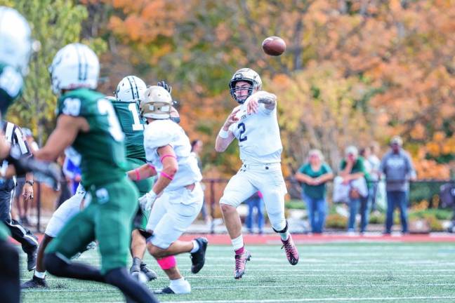 <b>Pope John quarterback Luke Irwin zips a pass downfield during second-quarter play.</b>