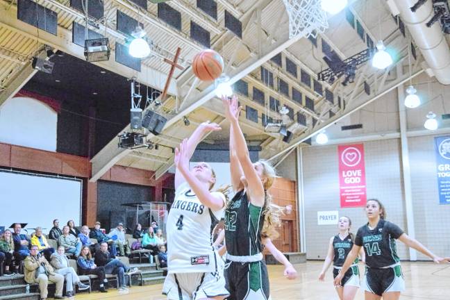 Wallkill Valley's Kate Fahrenfeld (4) tosses the ball toward the hoop in the game against Veritas Christian Academy on Feb. 13. Veritas won, 50-38, and Fahrenfeld scored 21 points. (Photos by George Leroy Hunter)