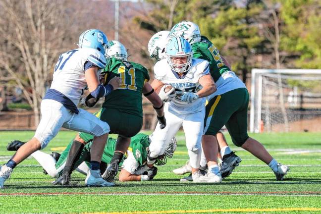 <b>SF4 Sparta running back Luke Brown emerges from Montville’s defensive line for a big first-quarter gain. (Photo by Glenn Clark)</b>