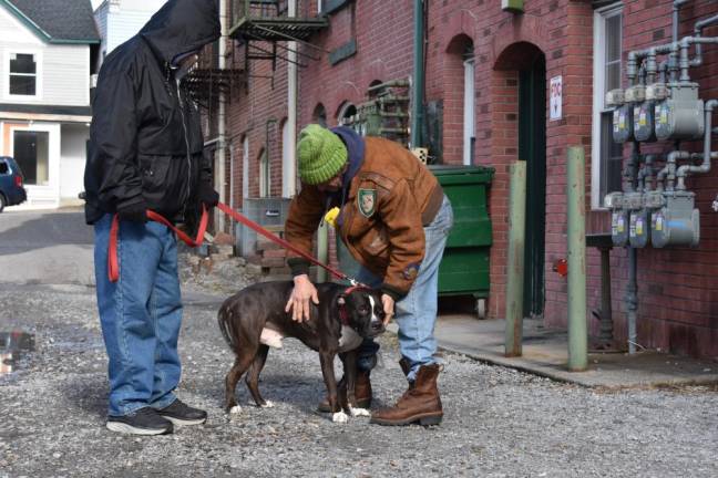 Larry McNabb and his pit bull, Duke, are greeted on arrival at Harvest House.