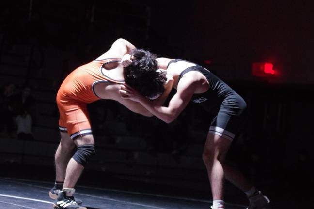 A Dover Tiger and a Wallkill Valley Ranger wrestle.