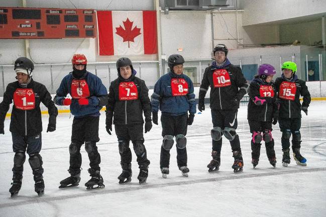 Speed skaters at the starting line.