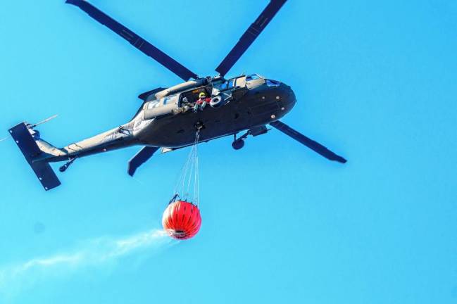 A helicopter drops water on the Jennings Creek Wildfire in Greenwood Lake on Tuesday, Nov. 12. (Photo by Susan Watts/Office of Governor Kathy Hochul)