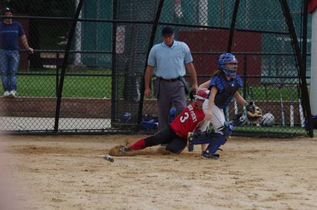High Point's Brianna Franko slides into home plate scoring the first point of the game.