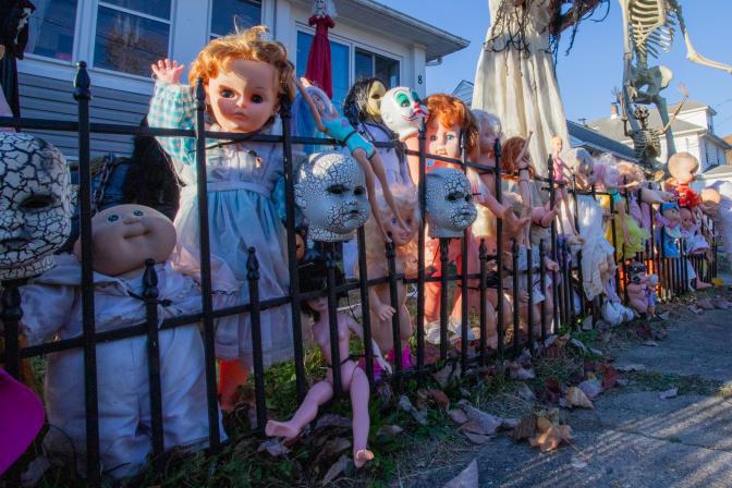 $!<b>The Lyman Ave. decorations also include a fence full of dolls. (Photo by Aja Brandt)</b>