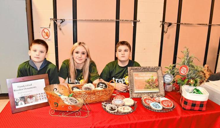 Lincoln, Grace and Jackson Gall are selling handcrafted wooden ornaments.