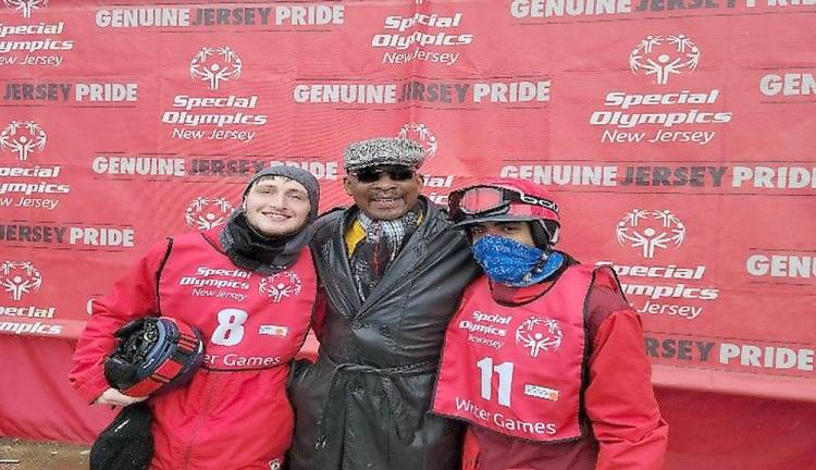 Vernon Mayor Howard Burrell, pictured here with athletes, opened the games in Vernon