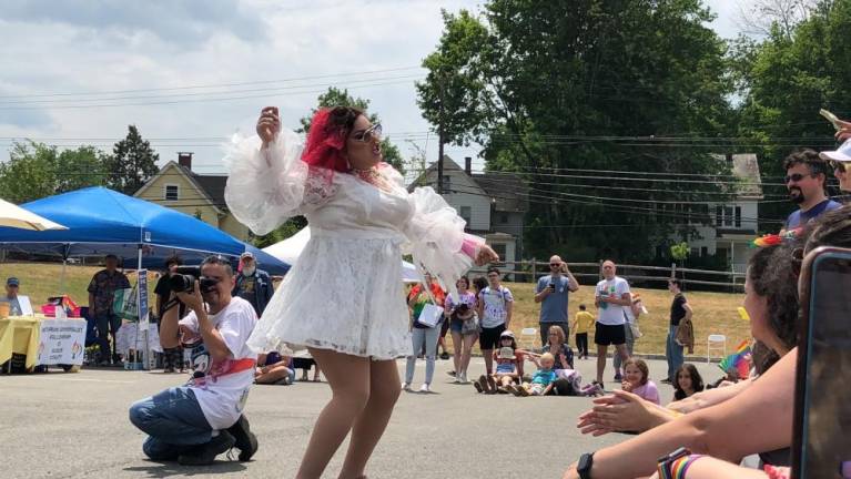 A drag performer known as Missy dances for the crowd.