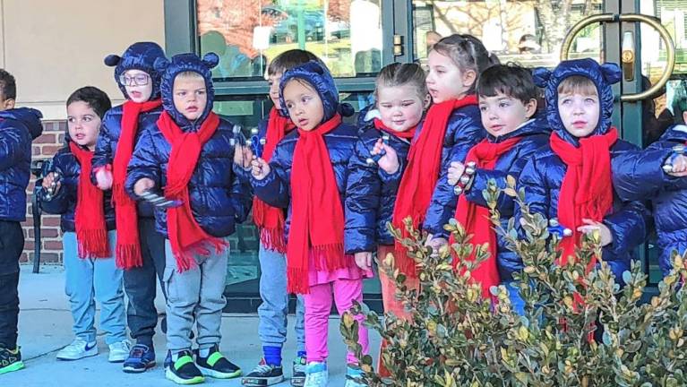 Students at Project Self-Sufficiency’s Little Sprouts Early Learning Center ring bells.