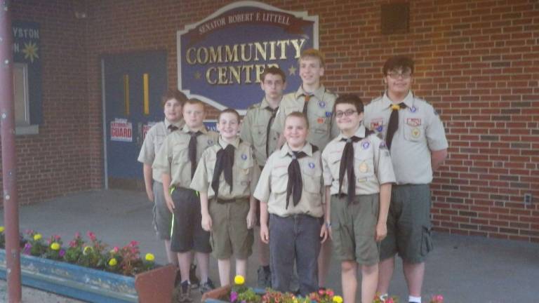 The boys of Boy Scout Troop 187 planted flowers at the Littell Center, where they hold their weekly Troop meetings.