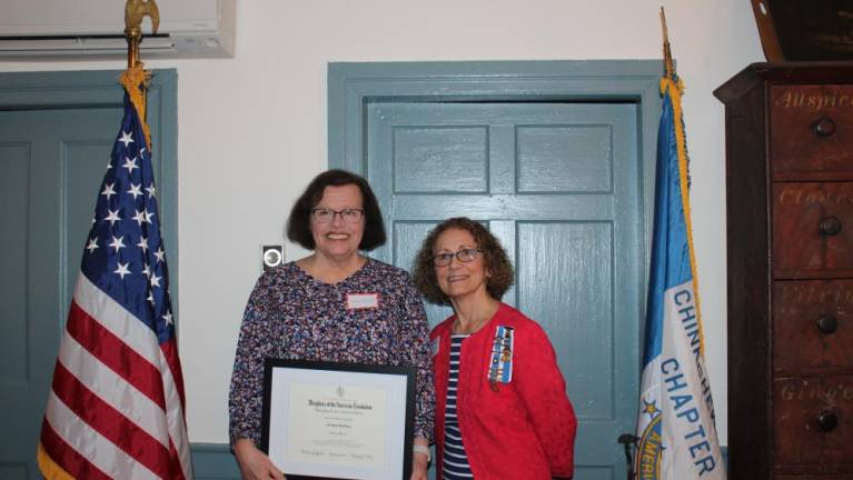 The 2023 Outstanding Teacher of American History was awarded to JoAnn DaSilva, left, of Newton High School. At right is Allyn Perry. chairwoman of the Chinkchewunska Chapter of the DAR.