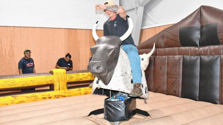 <b>Charles Marone of Byram rides a mechanical bull at Sussex County Day on Sunday, Sept. 15 at the Sussex County Fairgrounds. (Photos by Maria Kovic)</b>