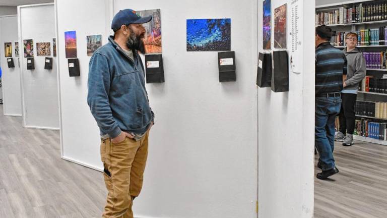 Wallkill Valley Regional High School students’ photos are on display Dec. 10. (Photo by Maria Kovic)