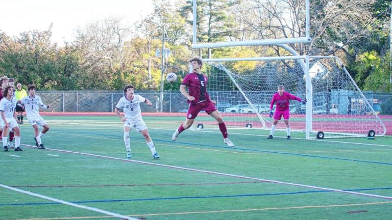 The soccer ball and a Newton Brave go airborne in the first period of the game against Jefferson at home Thursday, Oct. 17. The Falcons won, 1-0. (Photos by George Leroy Hunter)