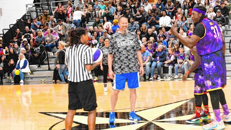 Wallkill Valley Regional High School special-education teacher Dan Gibson and other staff members take on the Harlem Wizards in a fundraising game Saturday night, Nov. 17. (Photos by Maria Kovic)